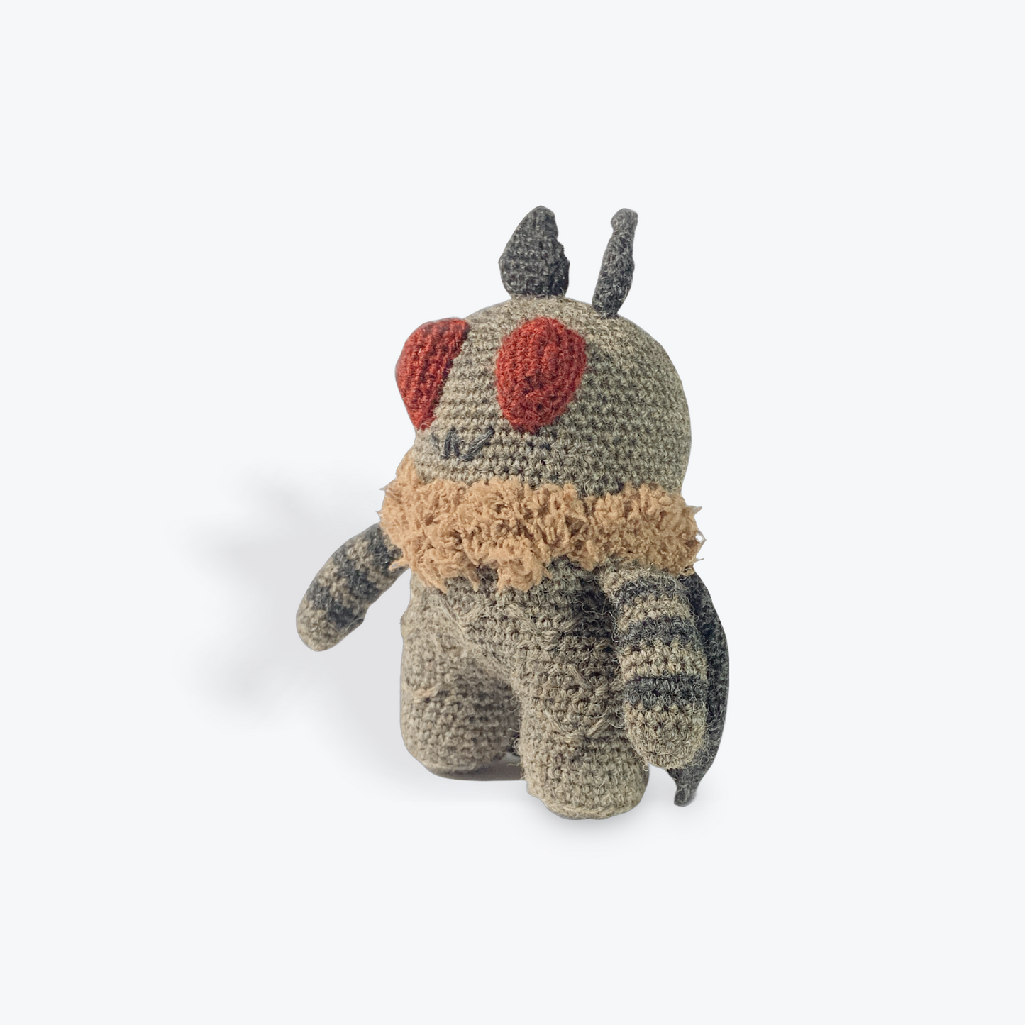Pocket-sized Mothman in grey and black