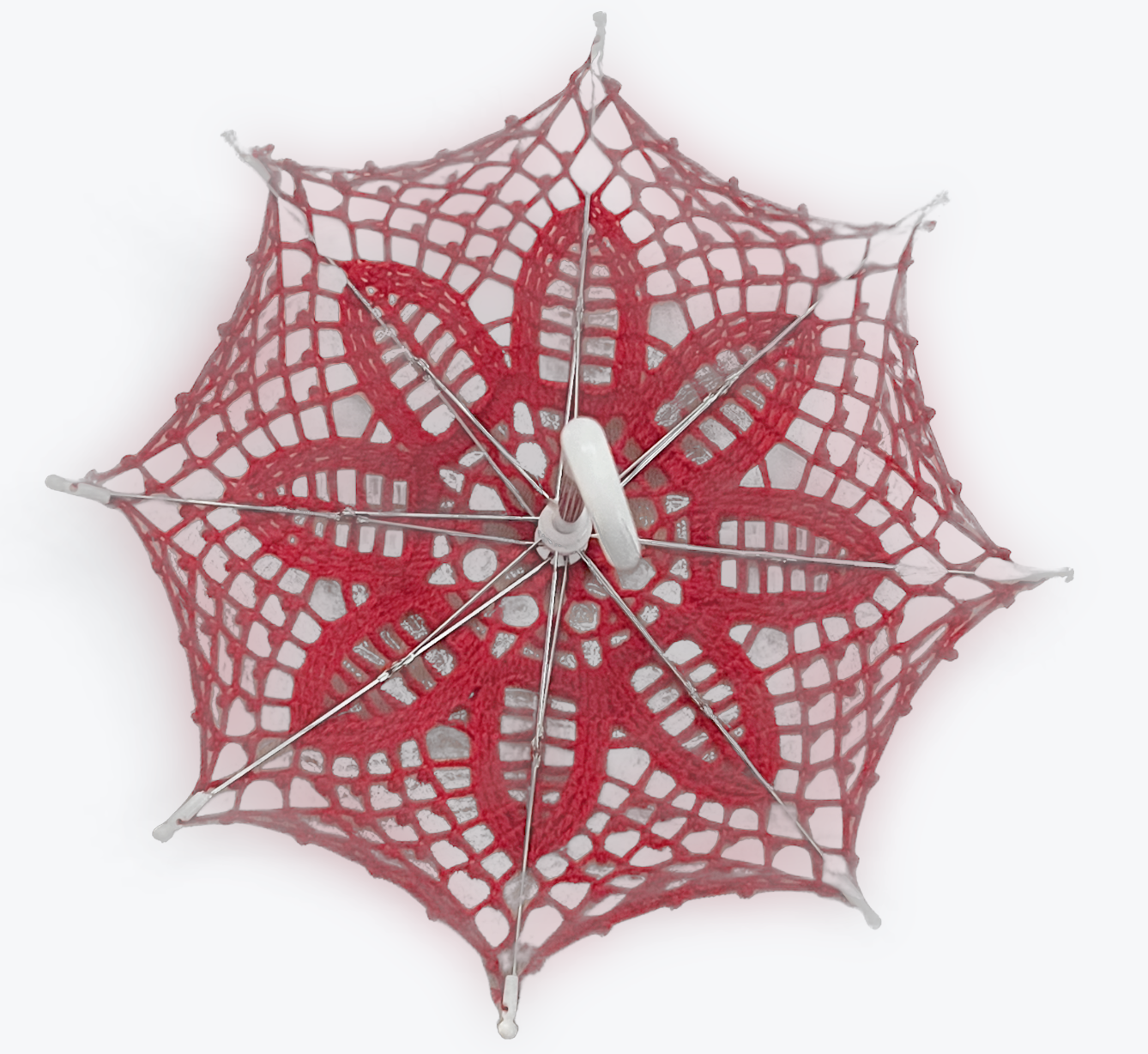 Red lace daisy pattern 12" parasol is open and upside down facing the viewer. The little white handle is coming toward the viewer in this picture. 